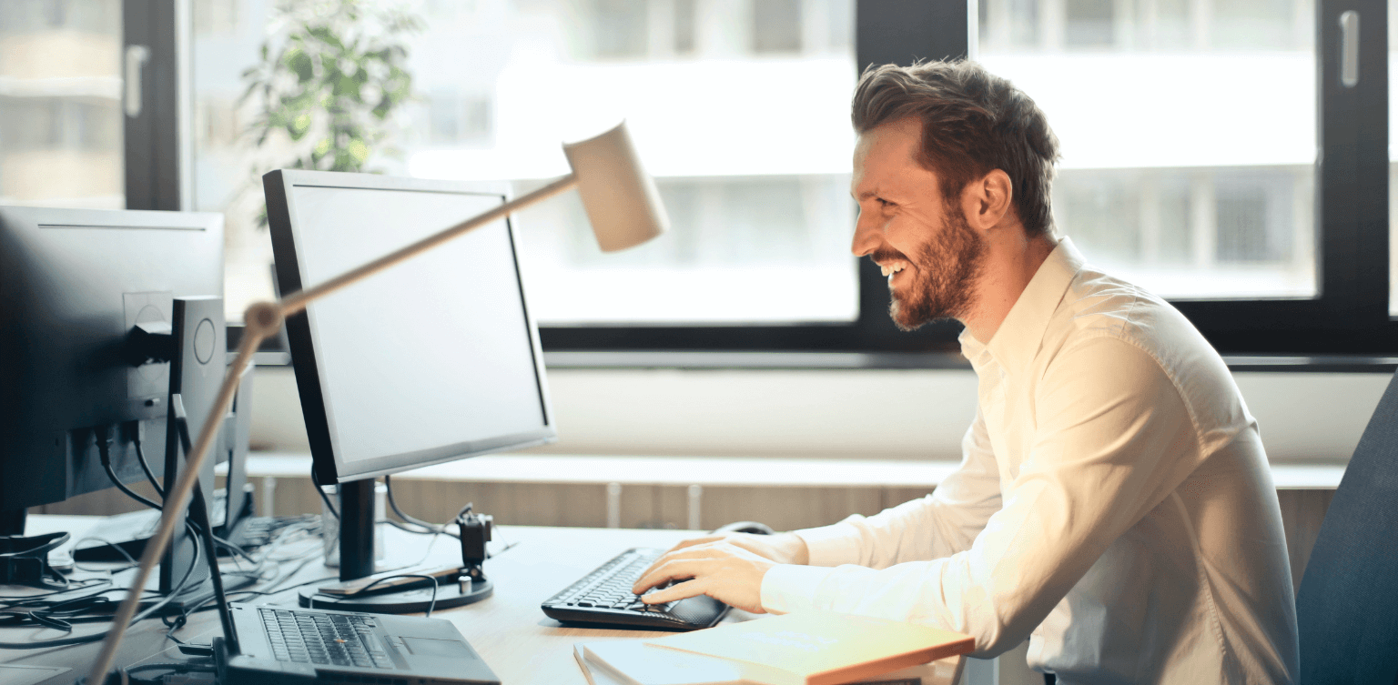 Man happy at work in the modern workforce