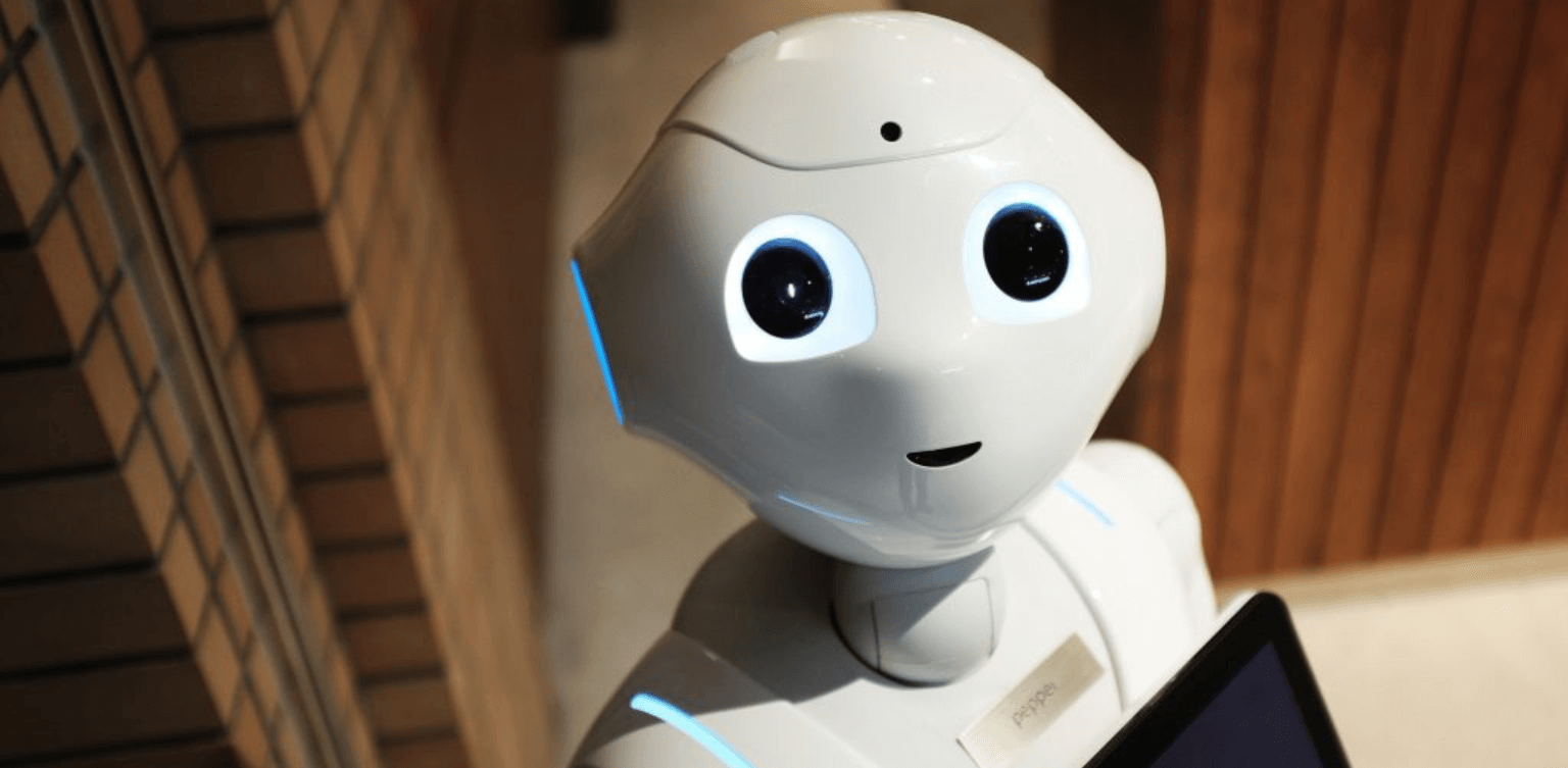 STEM Education & The Future of STEM - cute AI robot holding a tablet