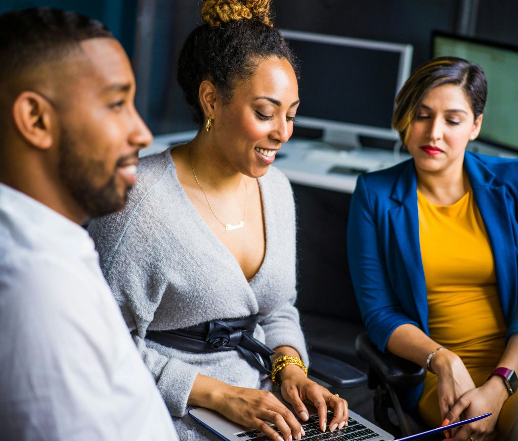 Corporate group looking at a laptop