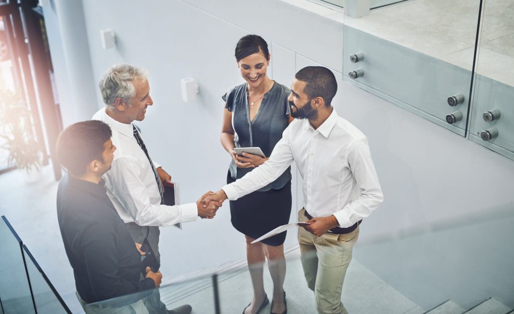 Group of people shaking hands