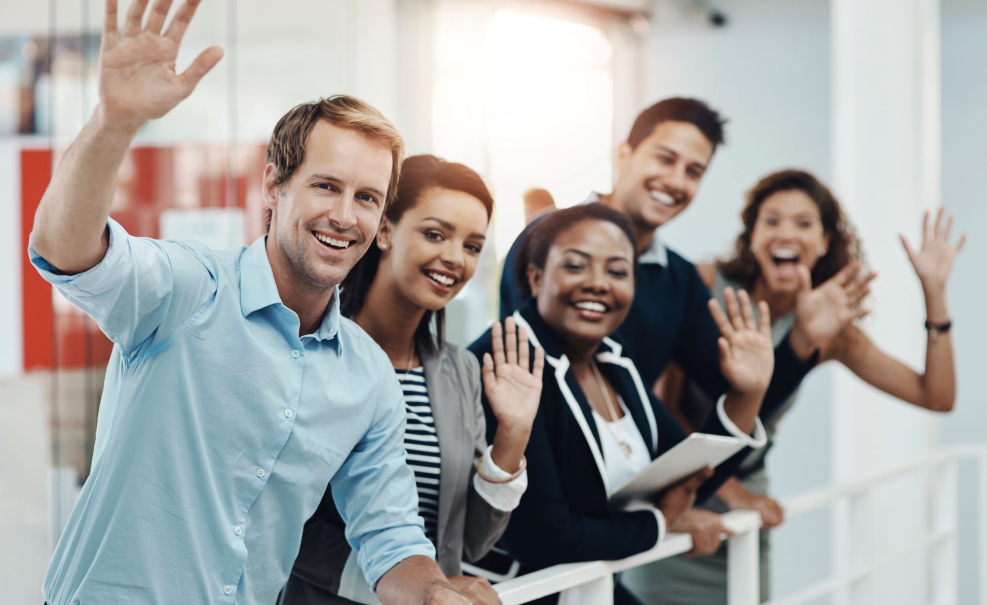 a group of people waving