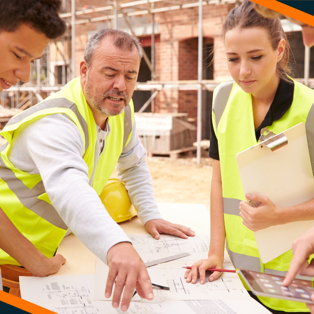 Apprenticeship and leader looking at construction plans